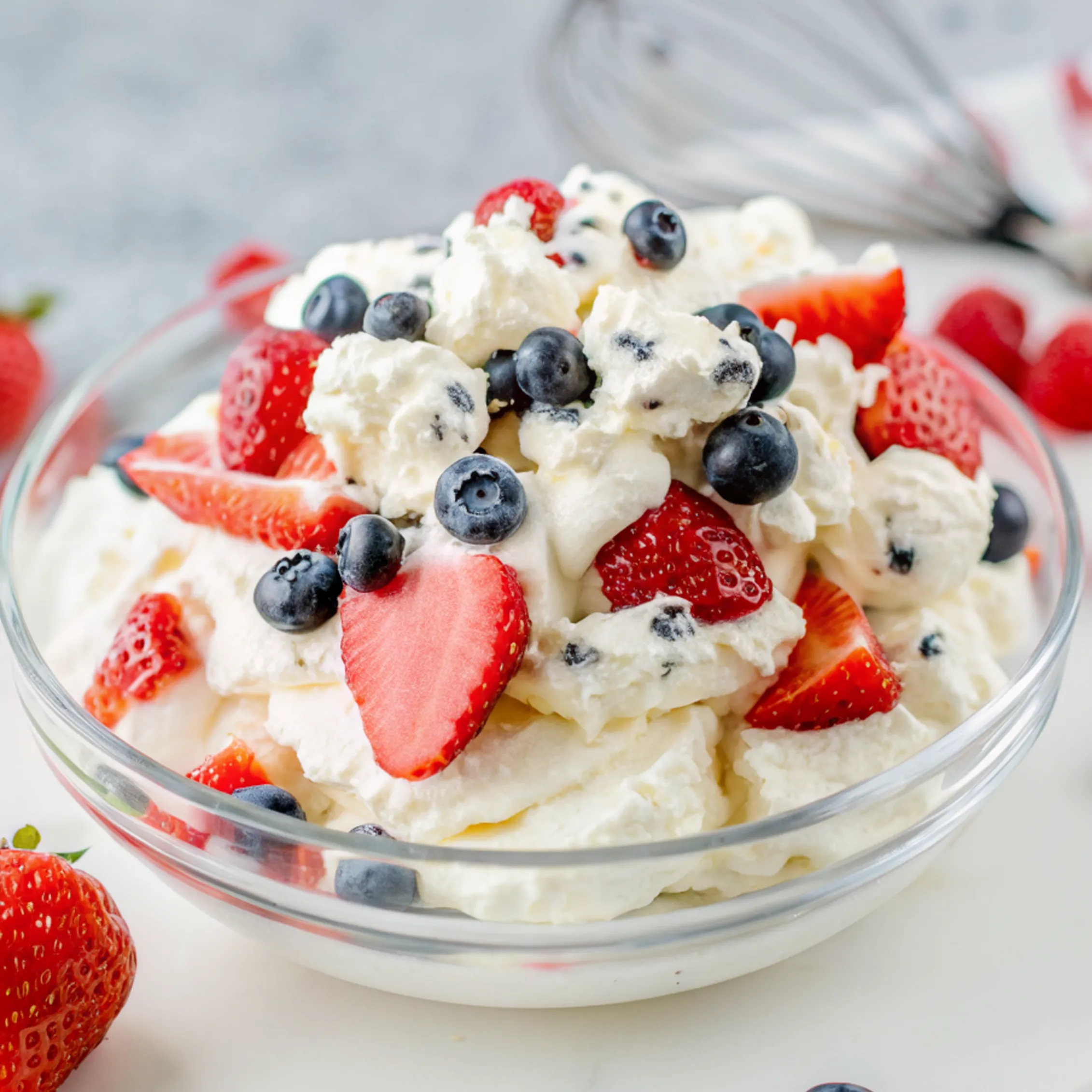 a bowl of Red White and Blue Cheesecake Salad